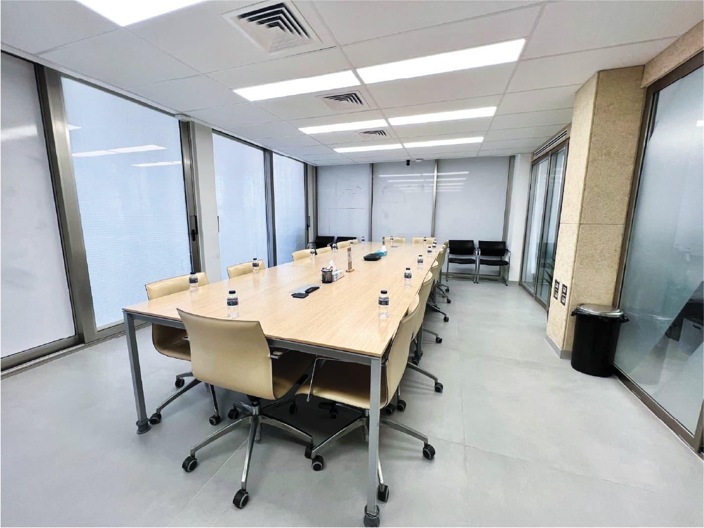 Conference Room - full table setup with water service and whiteboard