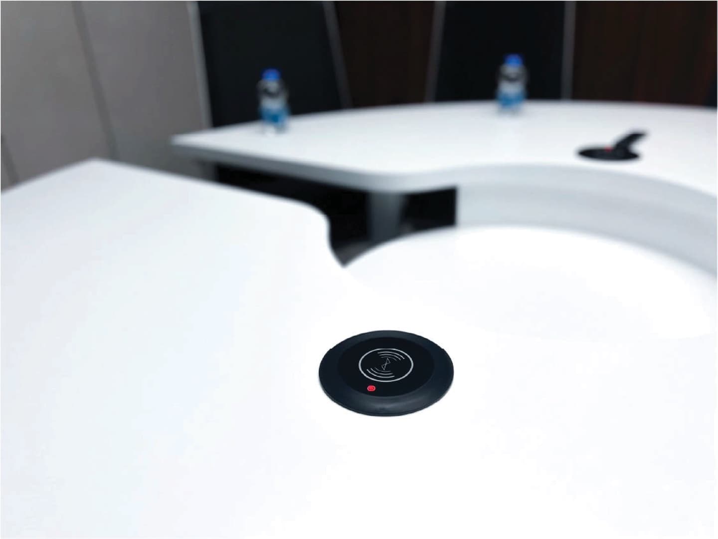 Round Room - built-in wireless charging pad on table surface