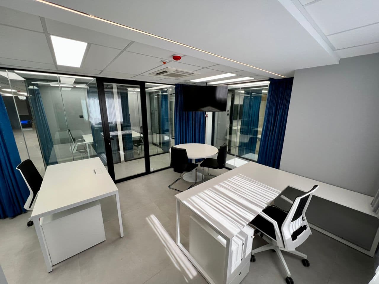 Spacious private office with two desks