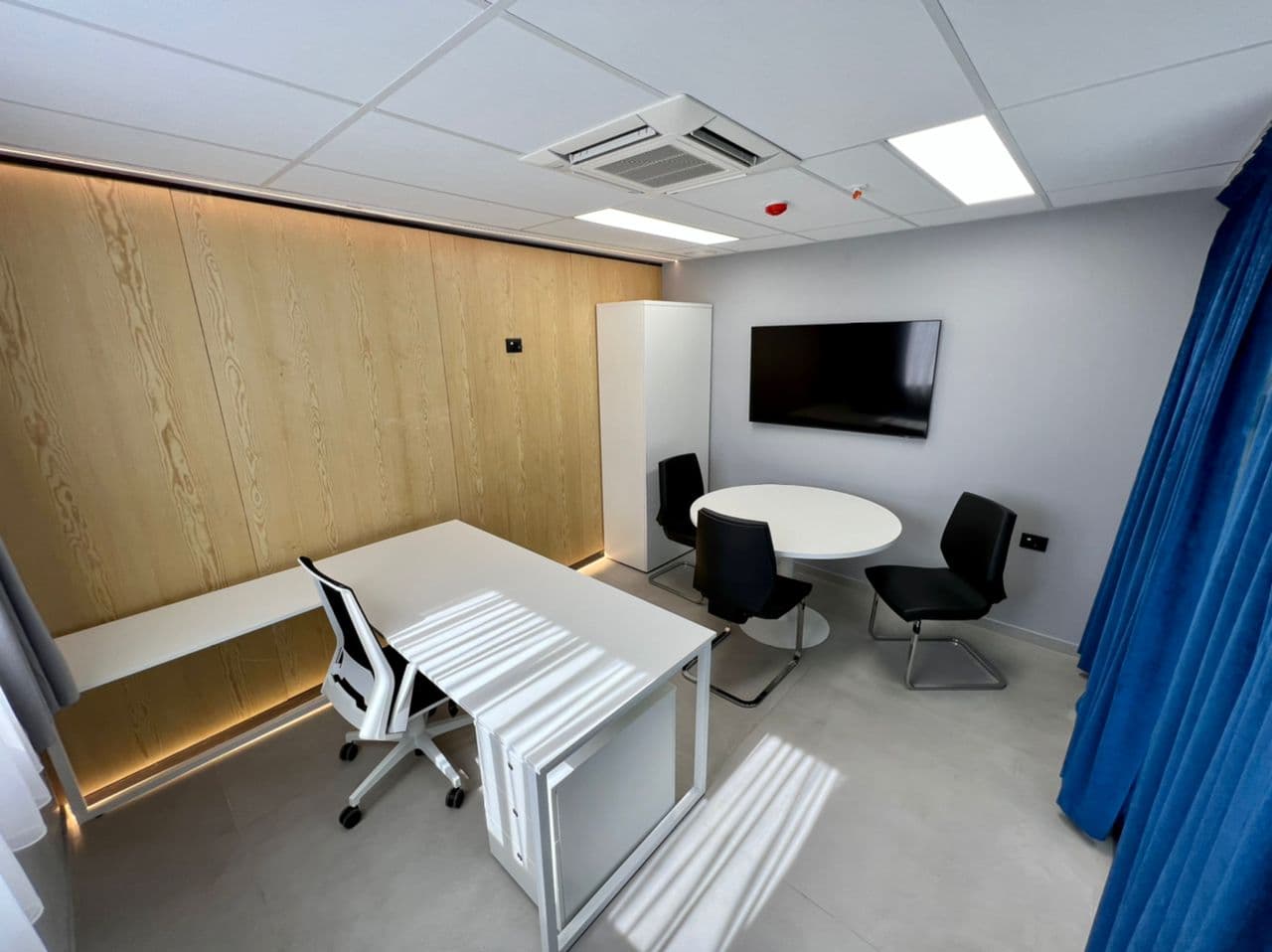 Private office with round meeting table