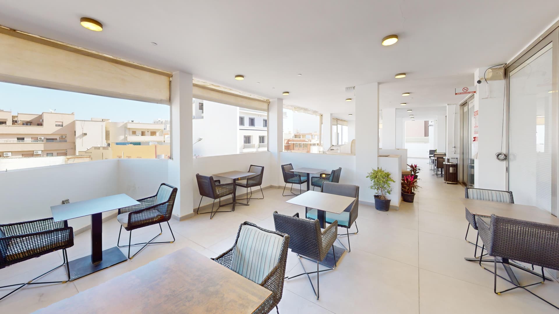 Rooftop terrace with outdoor seating and city views